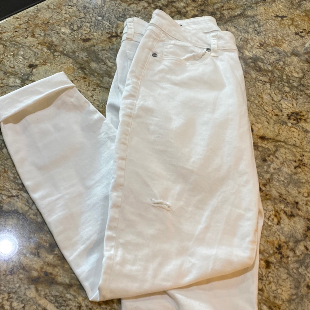White distressed jeans - small light mark toward the bottom of the left leg